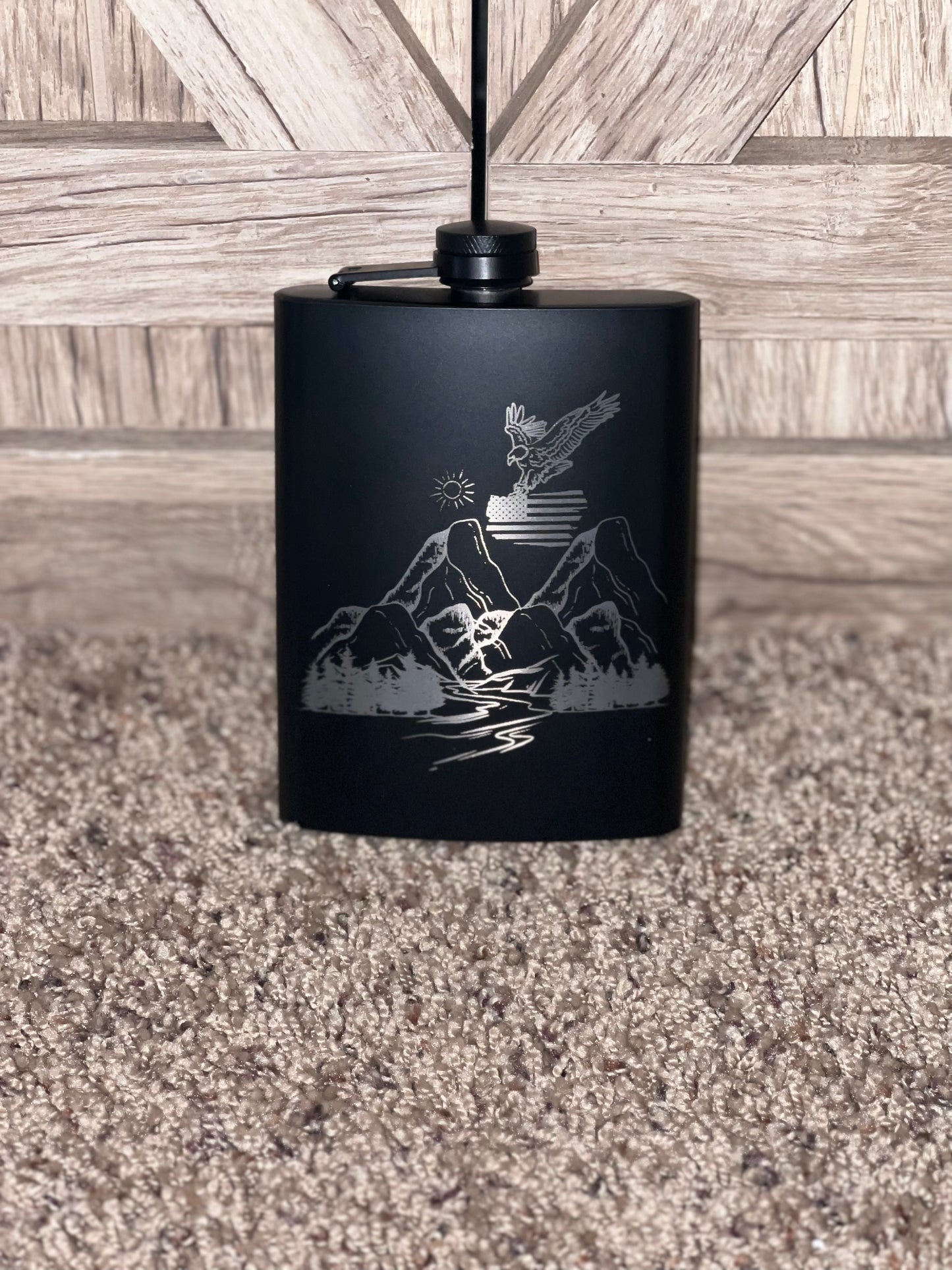 Eagle carrying flag flask